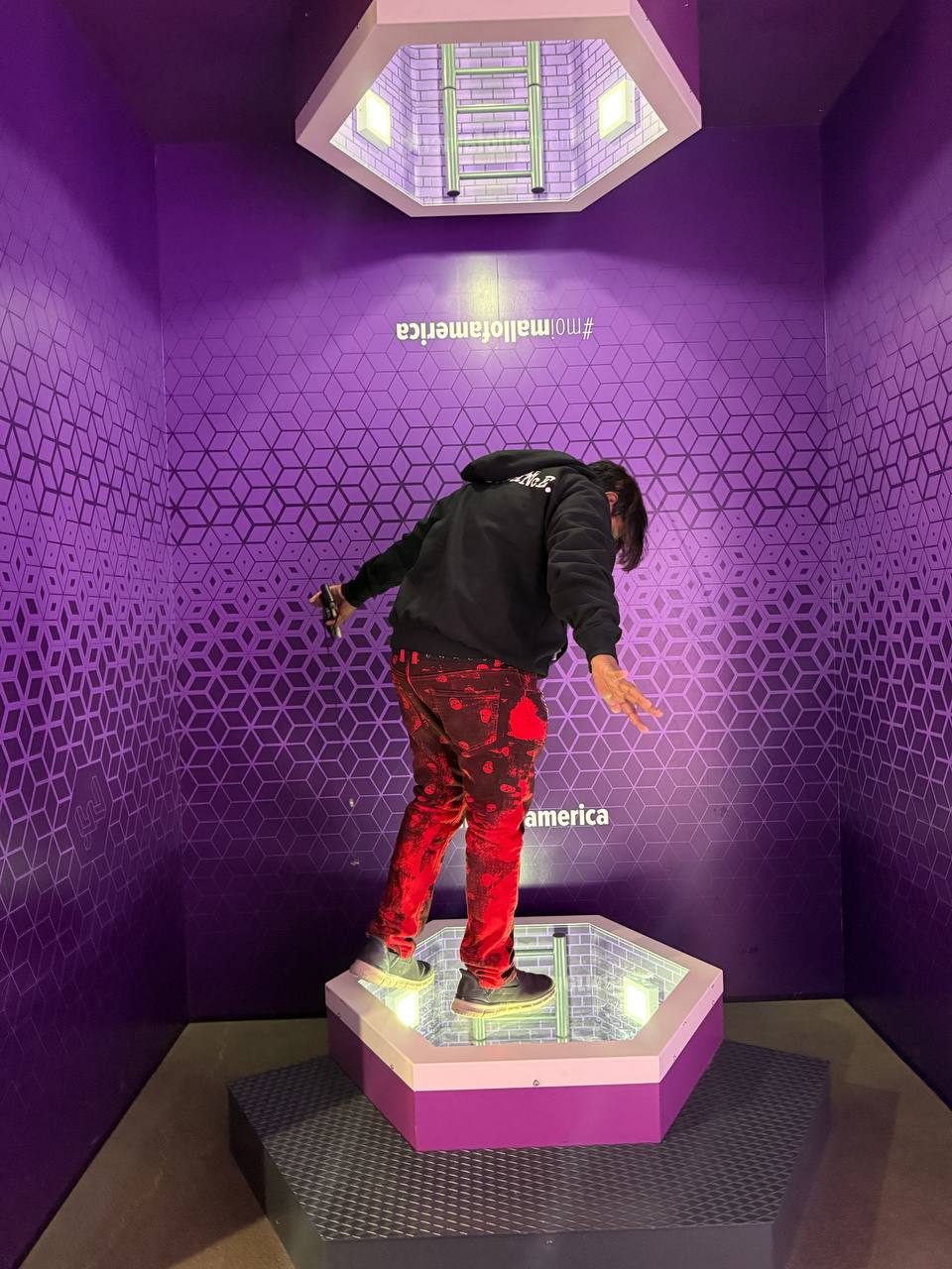 Standing on platform exhibit at Museum of Illusions